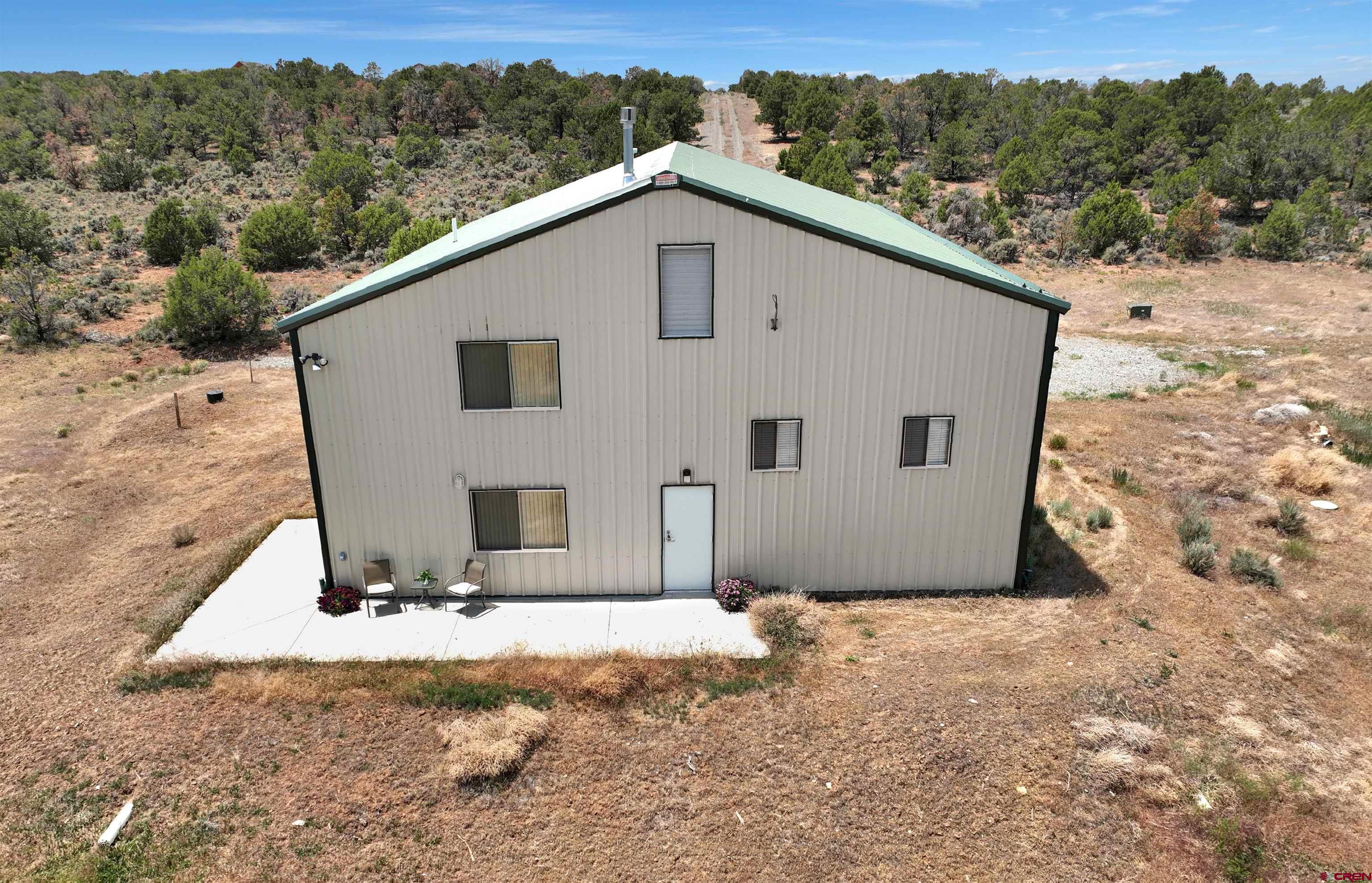 2984 Black Canyon Road Crawford, CO 81415 - Photo 30 of 35 a view of a house with a yard