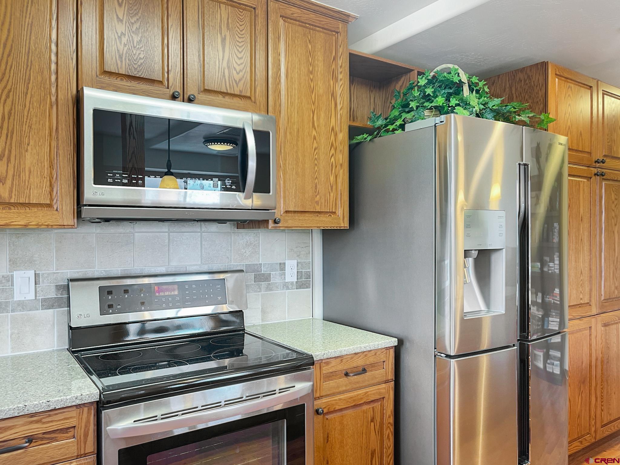2984 Black Canyon Road Crawford, CO 81415 - Photo 9 of 35 a kitchen with stainless steel appliances granite countertop a refrigerator and a stove top oven