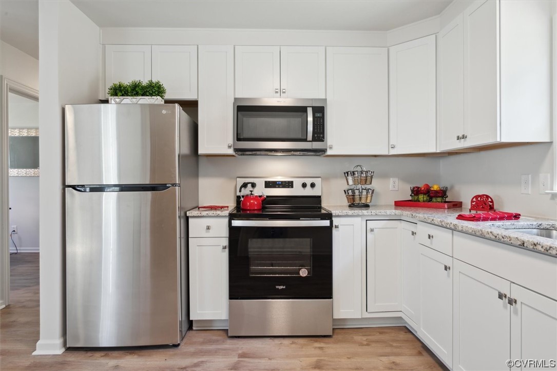 206 Mildred Drive Williamsburg, VA 23188 - Photo 2 of 34 a kitchen with stainless steel appliances a refrigerator sink and cabinets