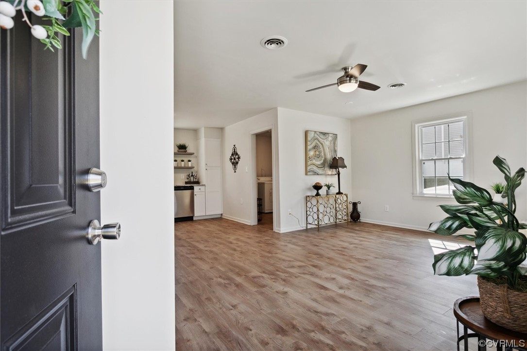 206 Mildred Drive Williamsburg, VA 23188 - Photo 21 of 34 a view of a livingroom with a potted plant a ceiling fan and wooden floor