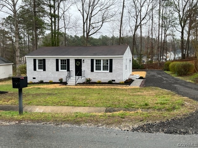 206 Mildred Drive Williamsburg, VA 23188 - Photo 23 of 34 a front view of house with yard and trees