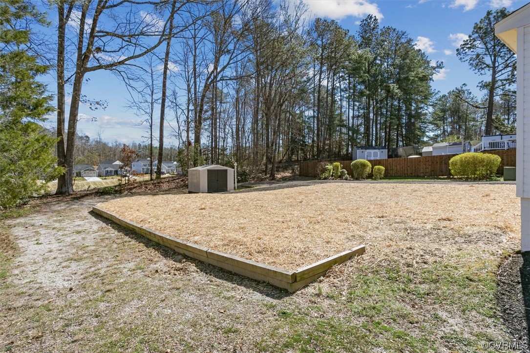 206 Mildred Drive Williamsburg, VA 23188 - Photo 30 of 34 a view of a backyard with snow on the road