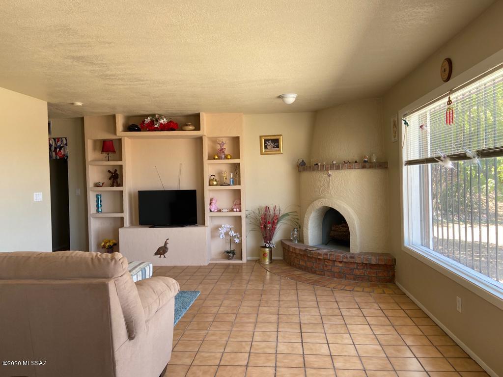 434 Rio Rico Drive Rio Rico, AZ 85648 - Photo 4 of 23 a living room with furniture and a flat screen tv