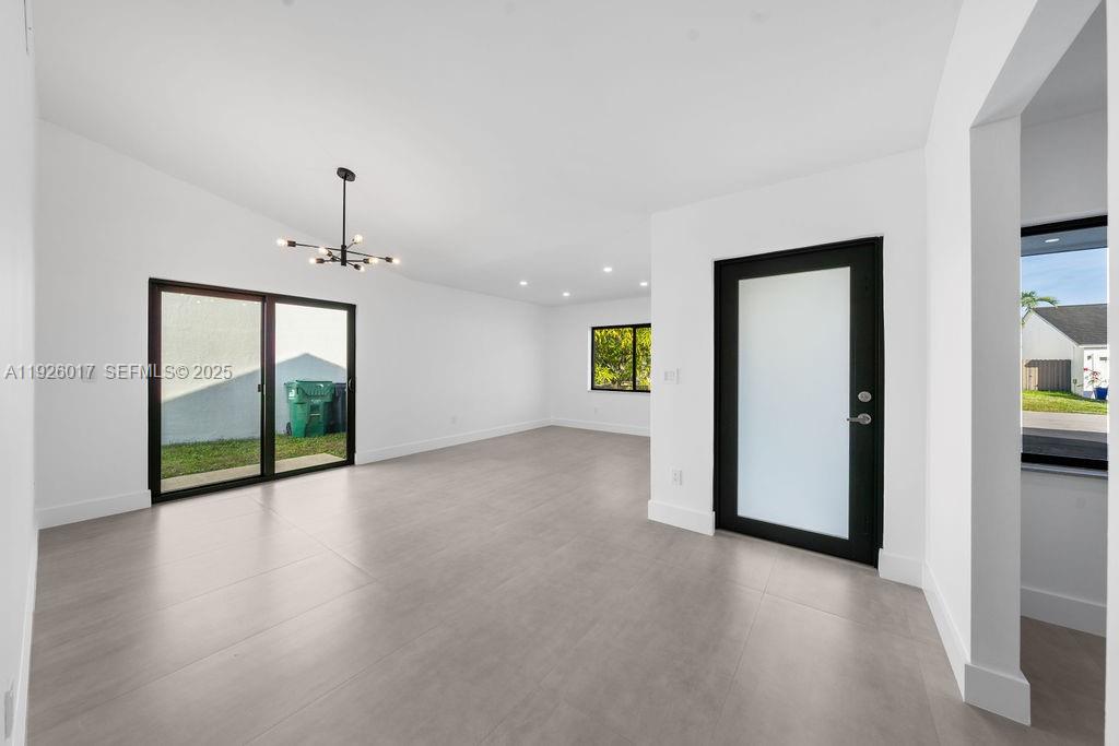 13338 Southwest 113th Place Miami, FL 33176 - Photo 20 of 32 a view of an empty room with a window