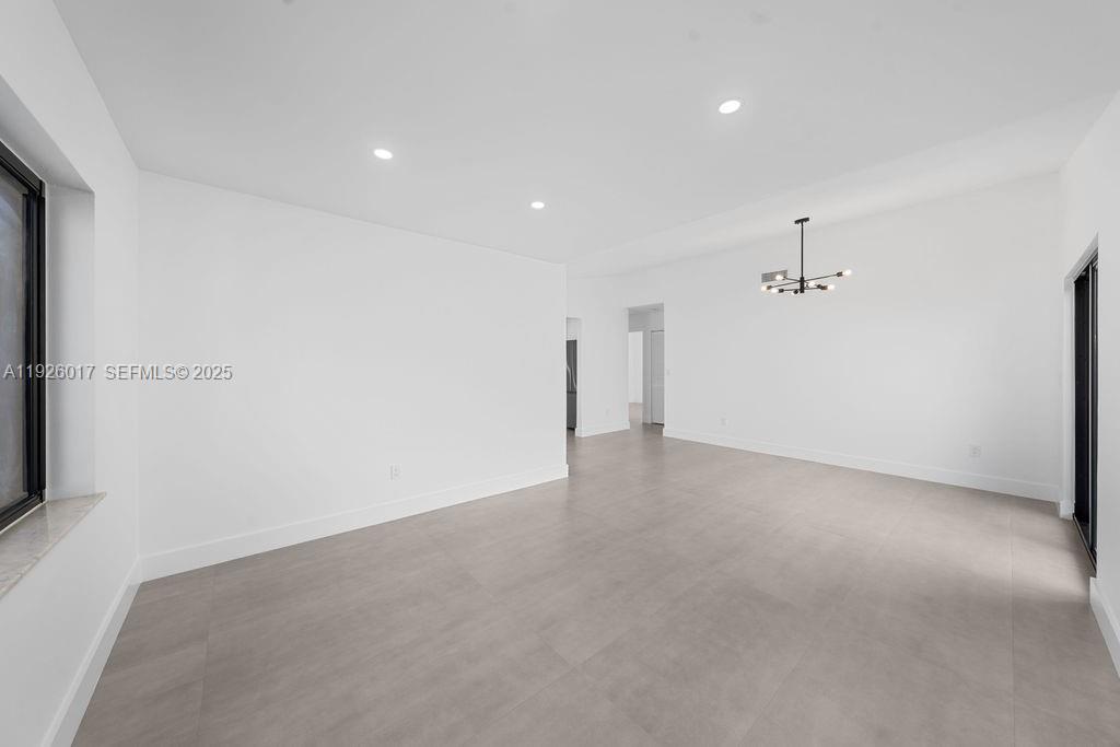 13338 Southwest 113th Place Miami, FL 33176 - Photo 24 of 32 wooden floor in an empty room