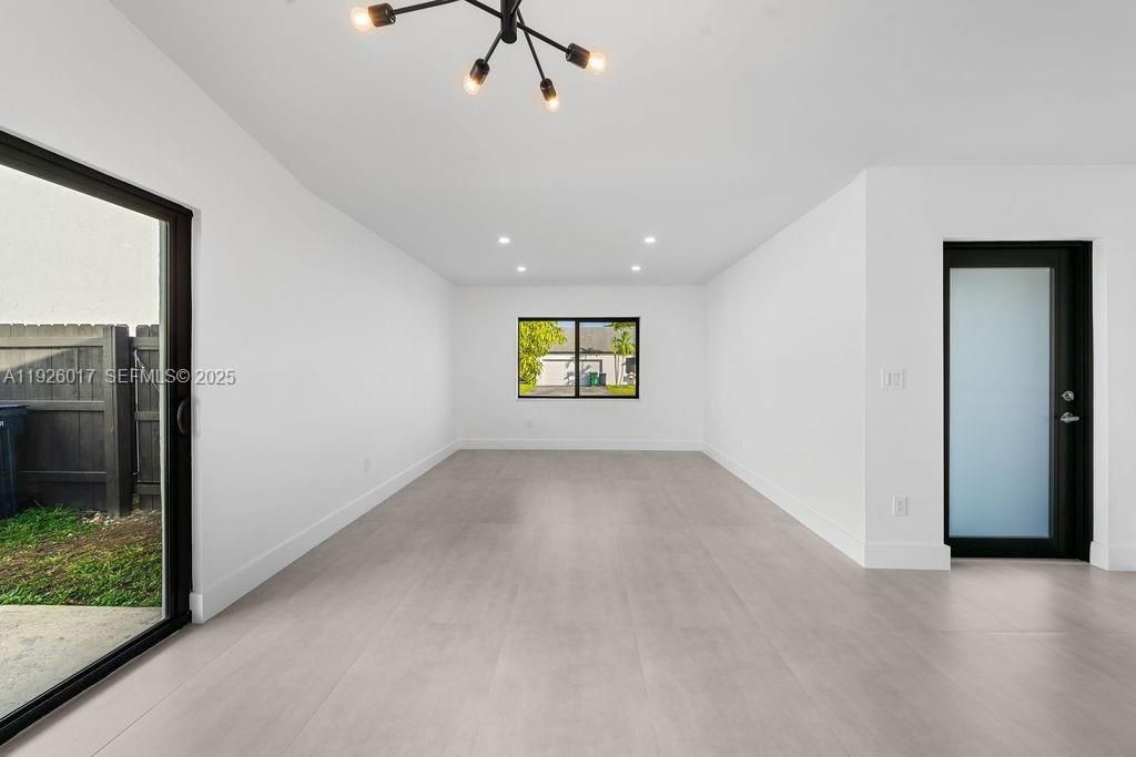 13338 Southwest 113th Place Miami, FL 33176 - Photo 25 of 32 a view of an empty room and a window