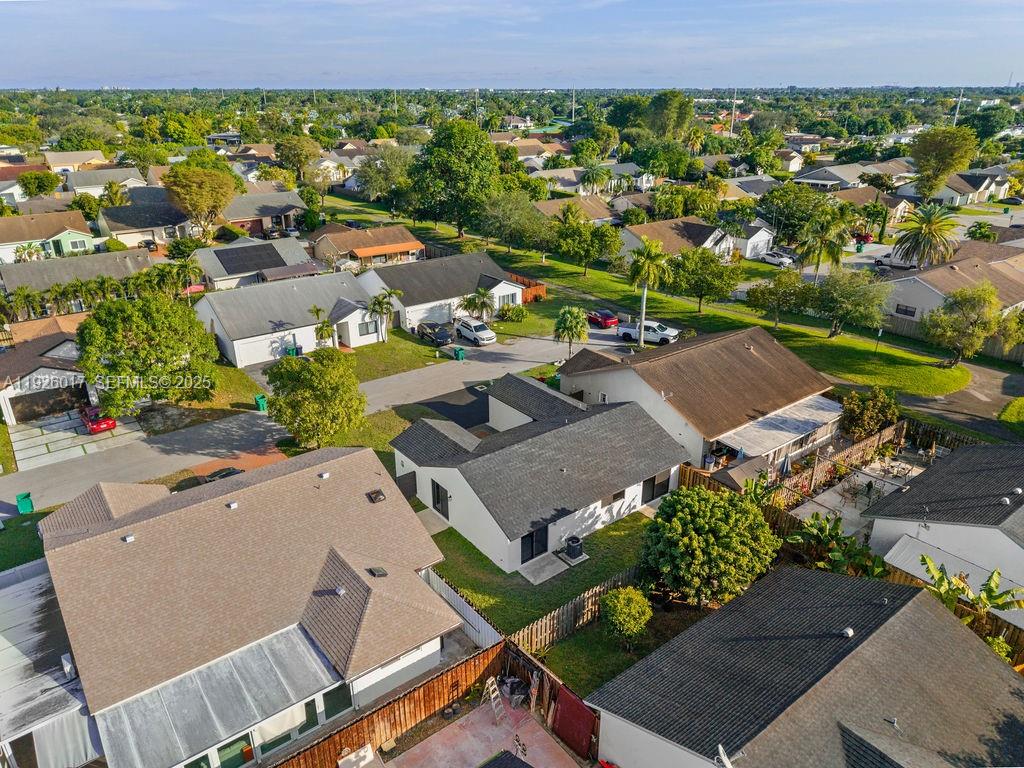 13338 Southwest 113th Place Miami, FL 33176 - Photo 3 of 32 an aerial view of residential houses with outdoor space