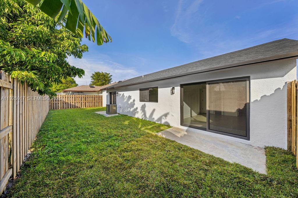 13338 Southwest 113th Place Miami, FL 33176 - Photo 32 of 32 a front view of a house with a yard