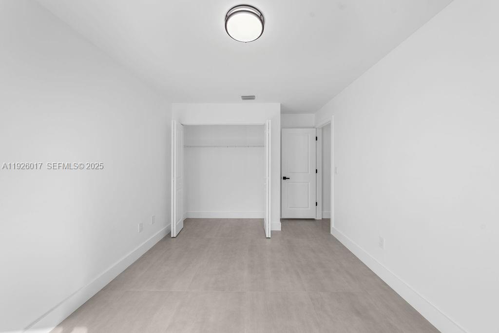 13338 Southwest 113th Place Miami, FL 33176 - Photo 6 of 32 a view of an empty room