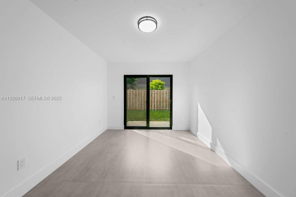 13338 Southwest 113th Place Miami, FL 33176 - Photo 7 of 32 a view of a room with a window