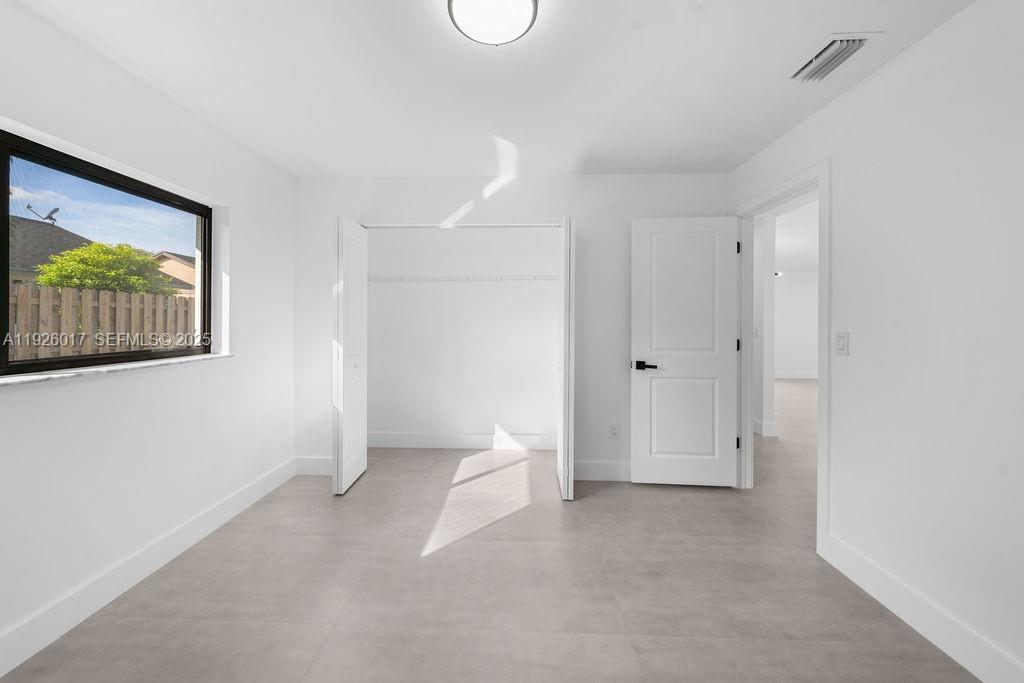 13338 Southwest 113th Place Miami, FL 33176 - Photo 10 of 32 a view of empty room with window