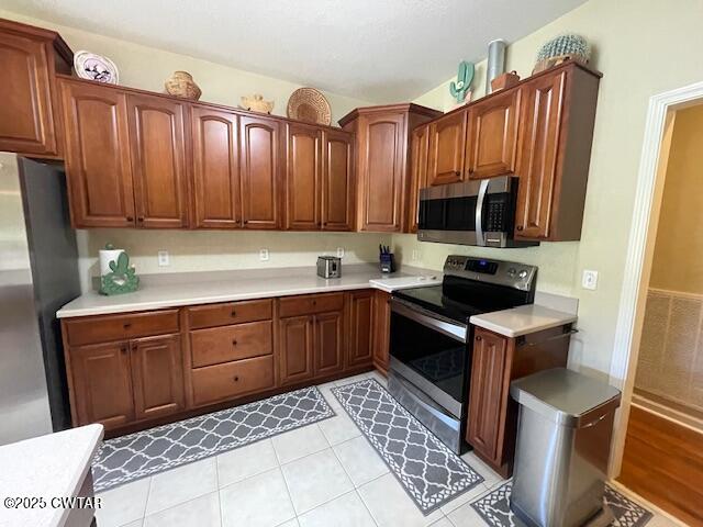 90 Links Bend Way Springville, TN 38256 - Photo 23 of 44 a kitchen with stainless steel appliances a stove a sink and a microwave