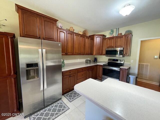 90 Links Bend Way Springville, TN 38256 - Photo 25 of 44 a kitchen with stainless steel appliances a refrigerator sink and microwave