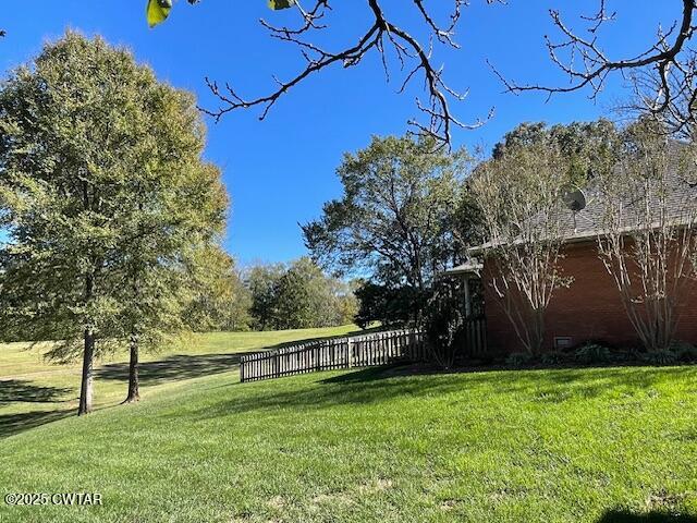 90 Links Bend Way Springville, TN 38256 - Photo 7 of 44 a view of a yard with wooden fence