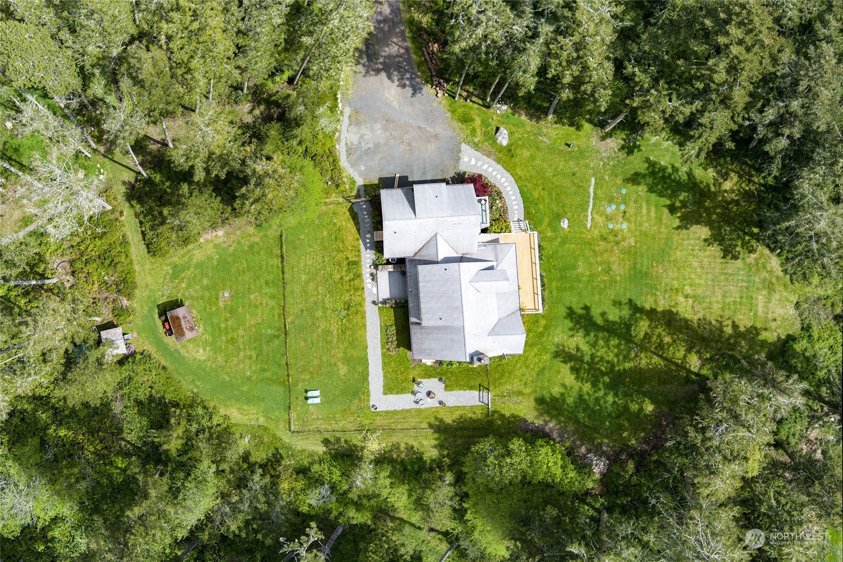 2858 Pear Point Road Friday Harbor, WA 98250 - Photo 12 of 40 an aerial view of a house with a yard basket ball court and outdoor seating