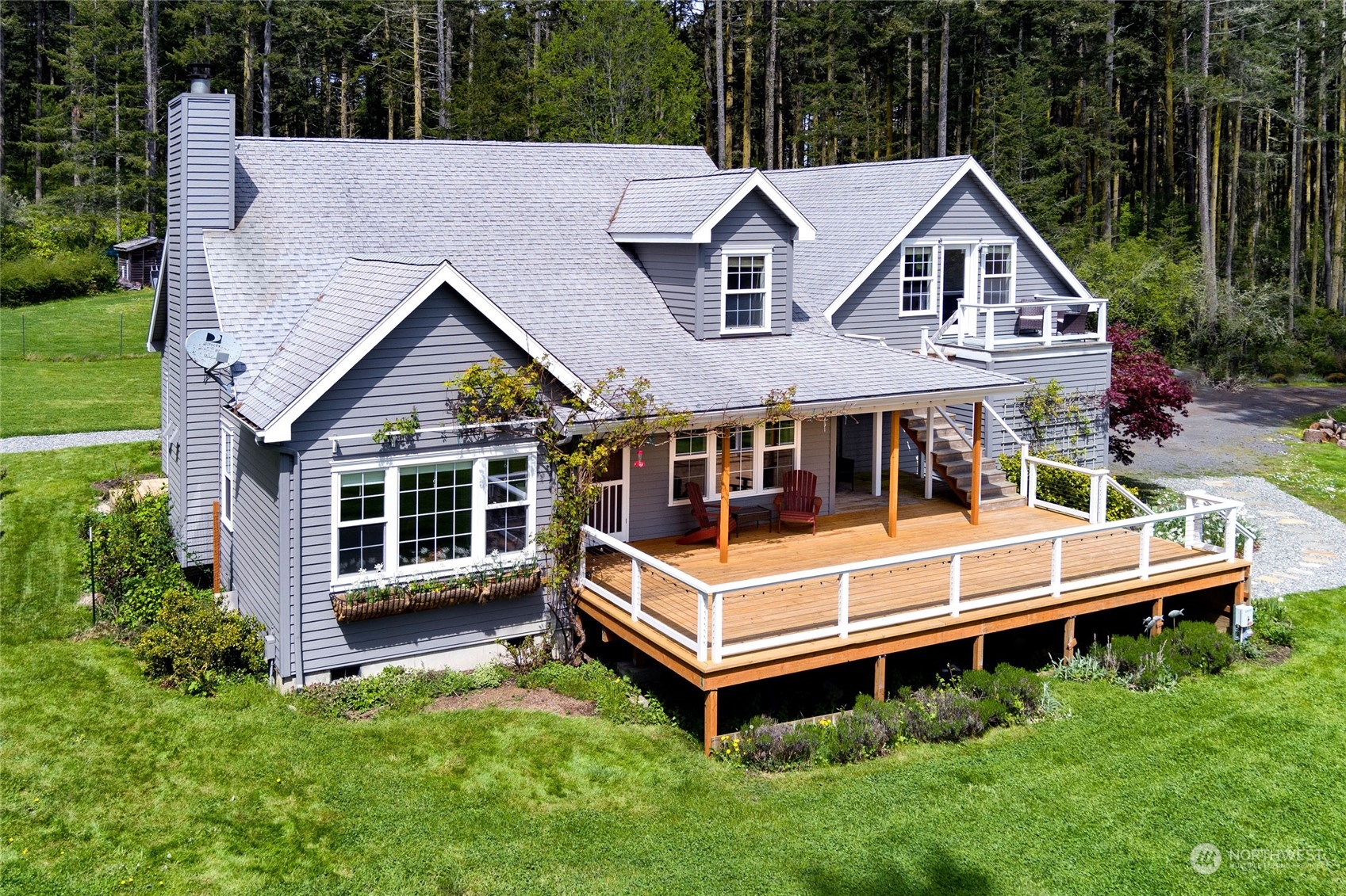 2858 Pear Point Road Friday Harbor, WA 98250 - Photo 4 of 40 a view of a house with a yard and sitting area