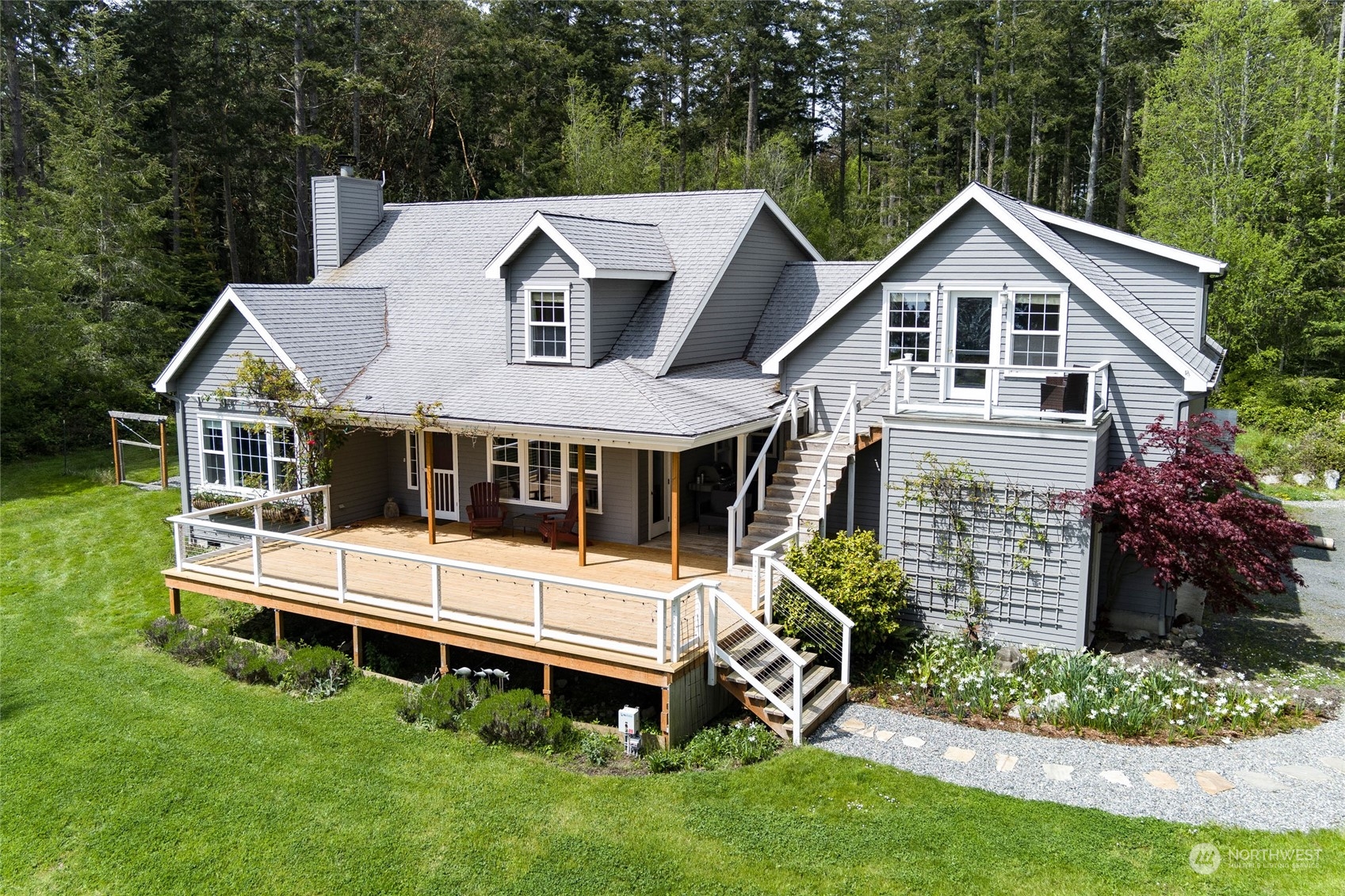 2858 Pear Point Road Friday Harbor, WA 98250 - Photo 5 of 40 a front view of a house with garden