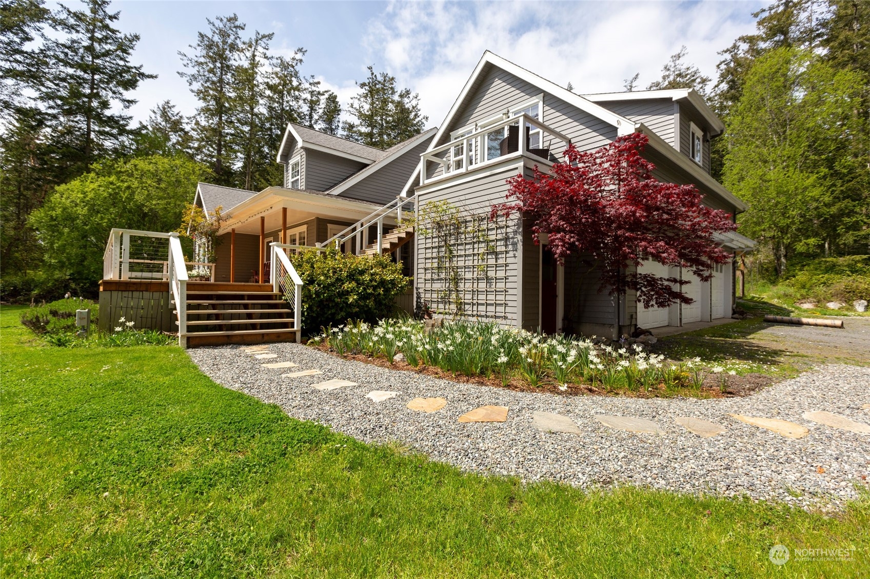 2858 Pear Point Road Friday Harbor, WA 98250 - Photo 6 of 40 a front view of a house with a garden