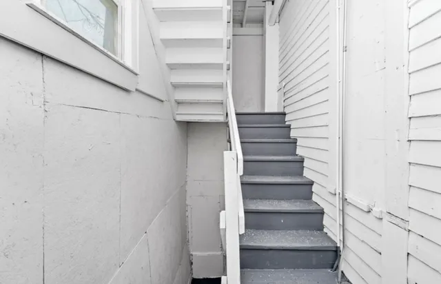 a aerial view of a house with a yard