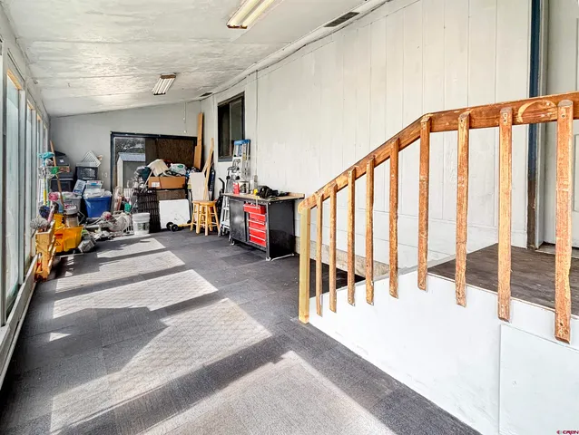 a view of living room with furniture and a large window