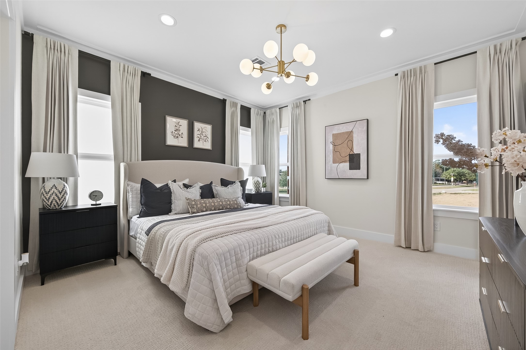 13711 New Shiloh Road Cypress, TX 77429 - Photo 9 of 13 a spacious bedroom with a bed and a chandelier