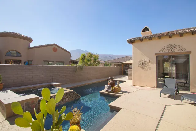 a view of a house with porch and furniture