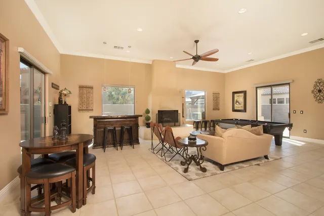 a bedroom with a large bed and a television