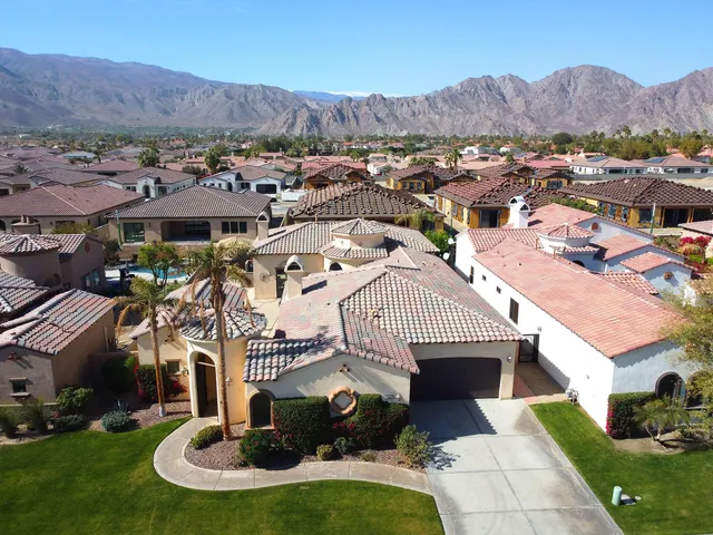 an aerial view of a house with a garden