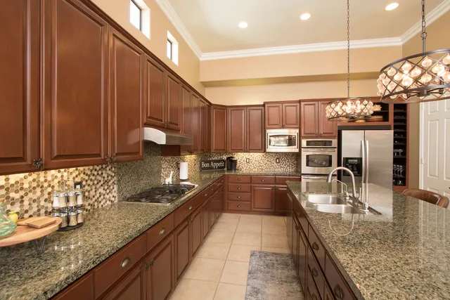 a bedroom with a large bed and a ceiling fan