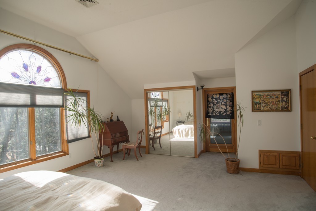 61 South Valley Road Amherst, MA 01002 - Photo 22 of 38 a living room with furniture and a large window