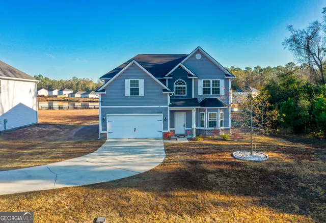 a front view of a house with a yard