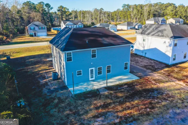 a view of multiple houses with a yard