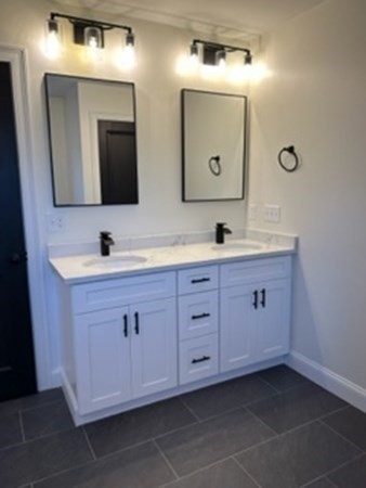 1479 Main Street Acushnet, MA 02743 - Photo 14 of 23 a bathroom with a double vanity sink and mirror