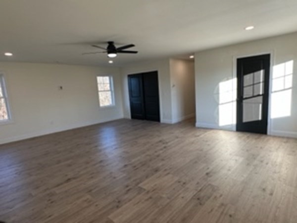 1479 Main Street Acushnet, MA 02743 - Photo 16 of 23 a view of an empty room with window and wooden floor