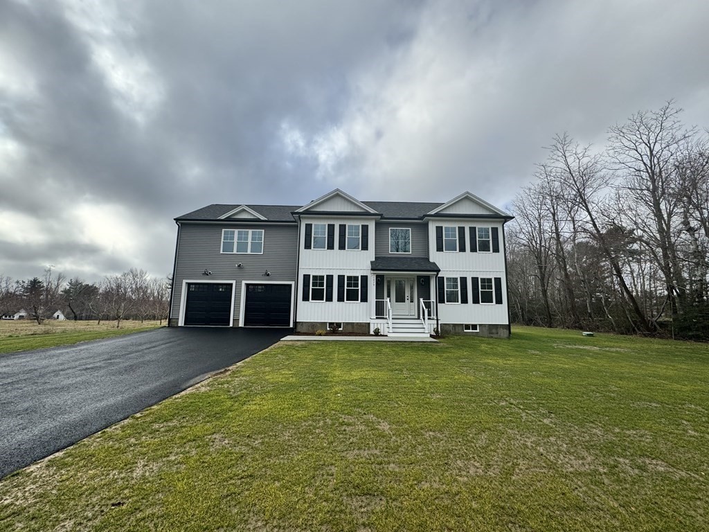 1479 Main Street Acushnet, MA 02743 - Photo 3 of 23 a view of a house with a big yard and large trees
