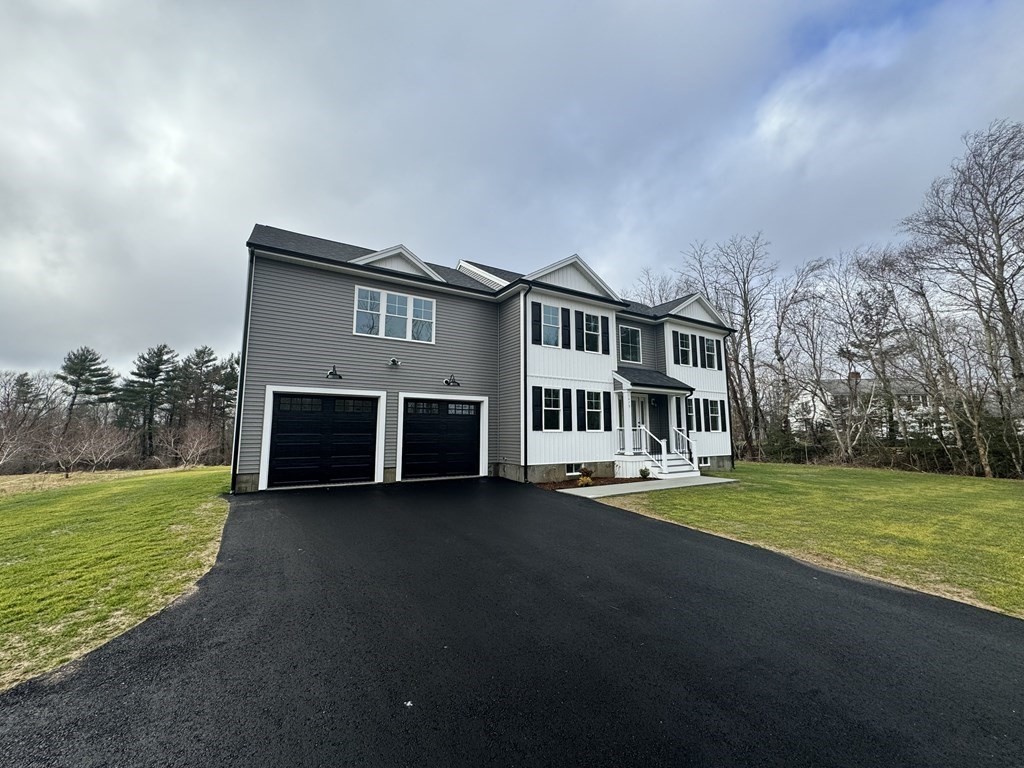 1479 Main Street Acushnet, MA 02743 - Photo 4 of 23 a view of a house with a big yard and large trees