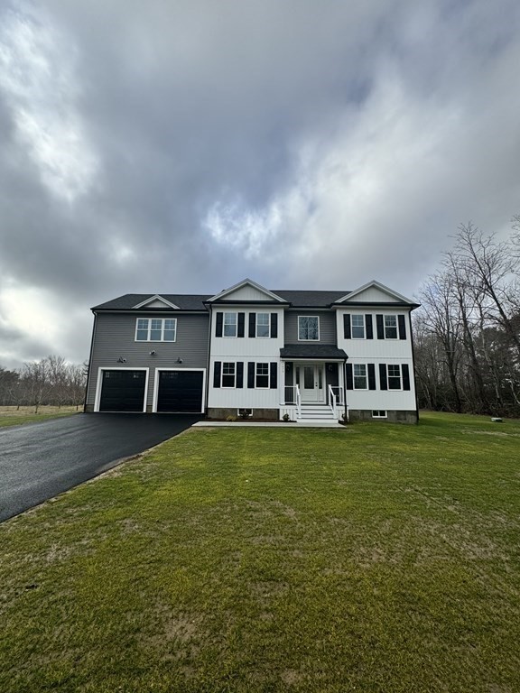 1479 Main Street Acushnet, MA 02743 - Photo 5 of 23 a front view of a house with a garden