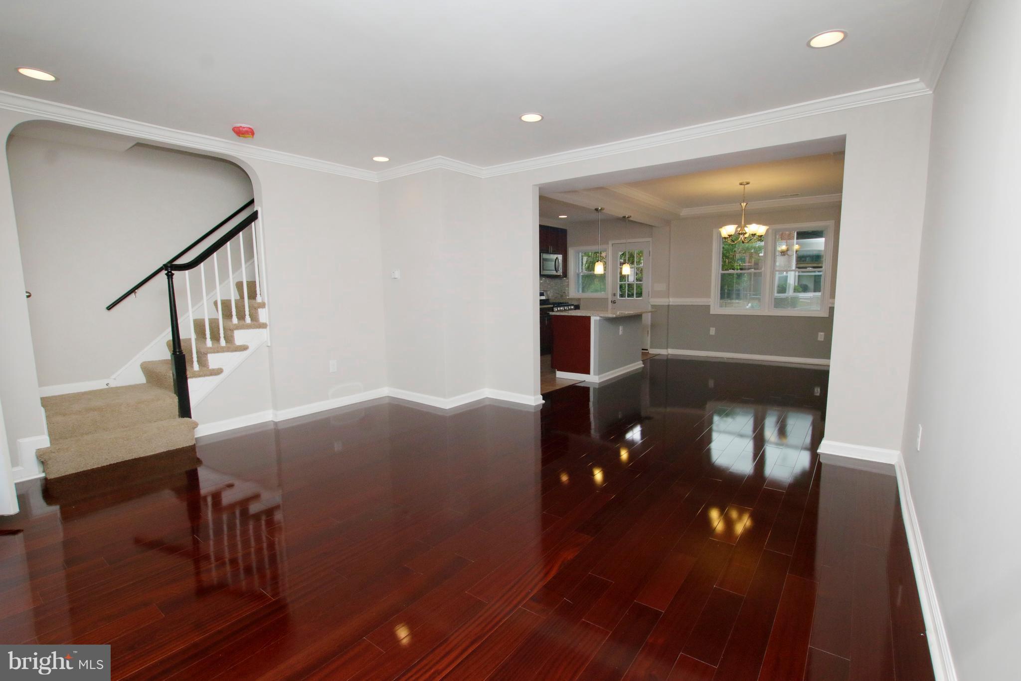 1220 Ramblewood Road Baltimore, MD 21239 - Photo 2 of 30 Living Room/ mahogany flooring