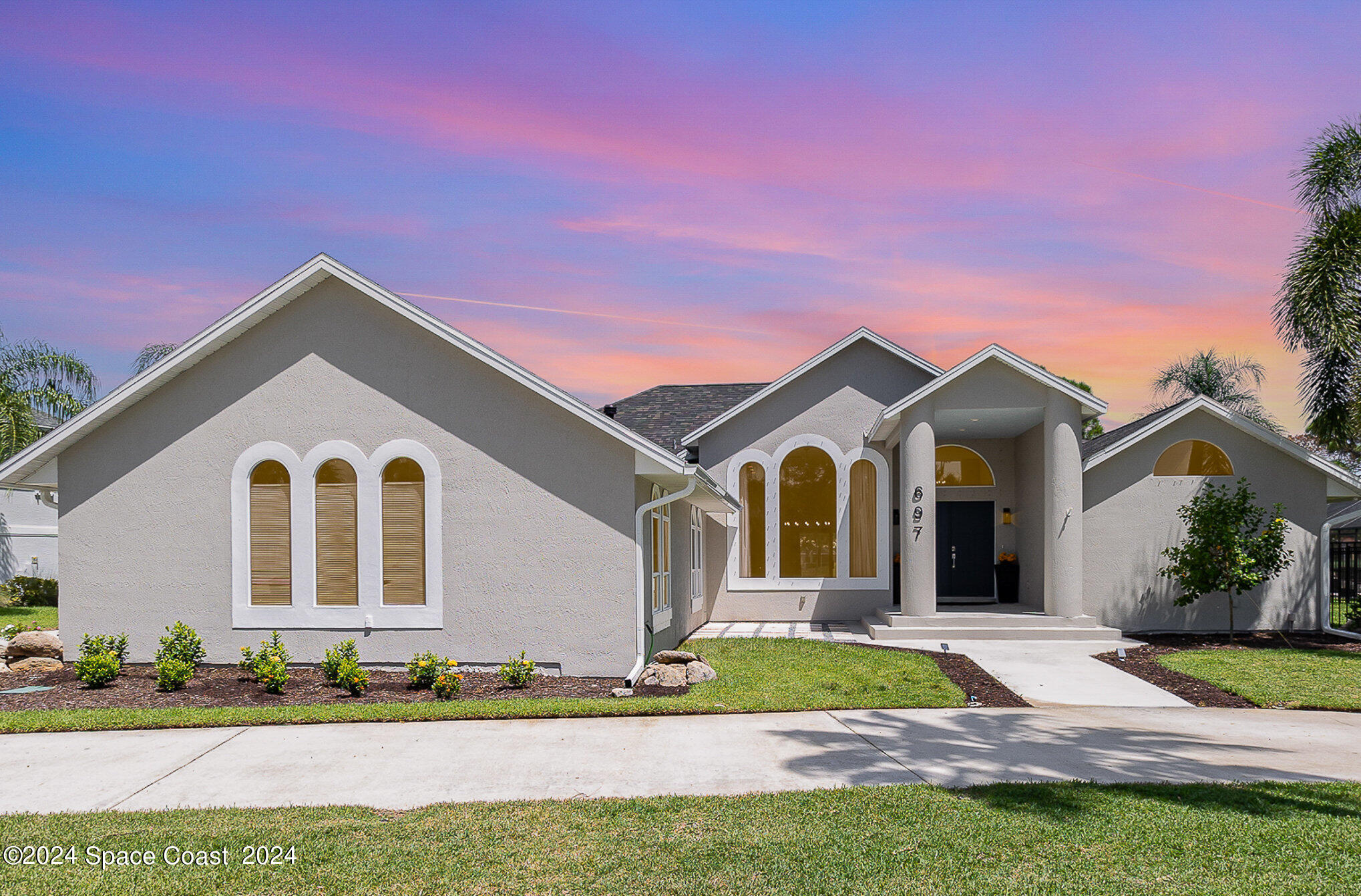 a front view of a house with a yard