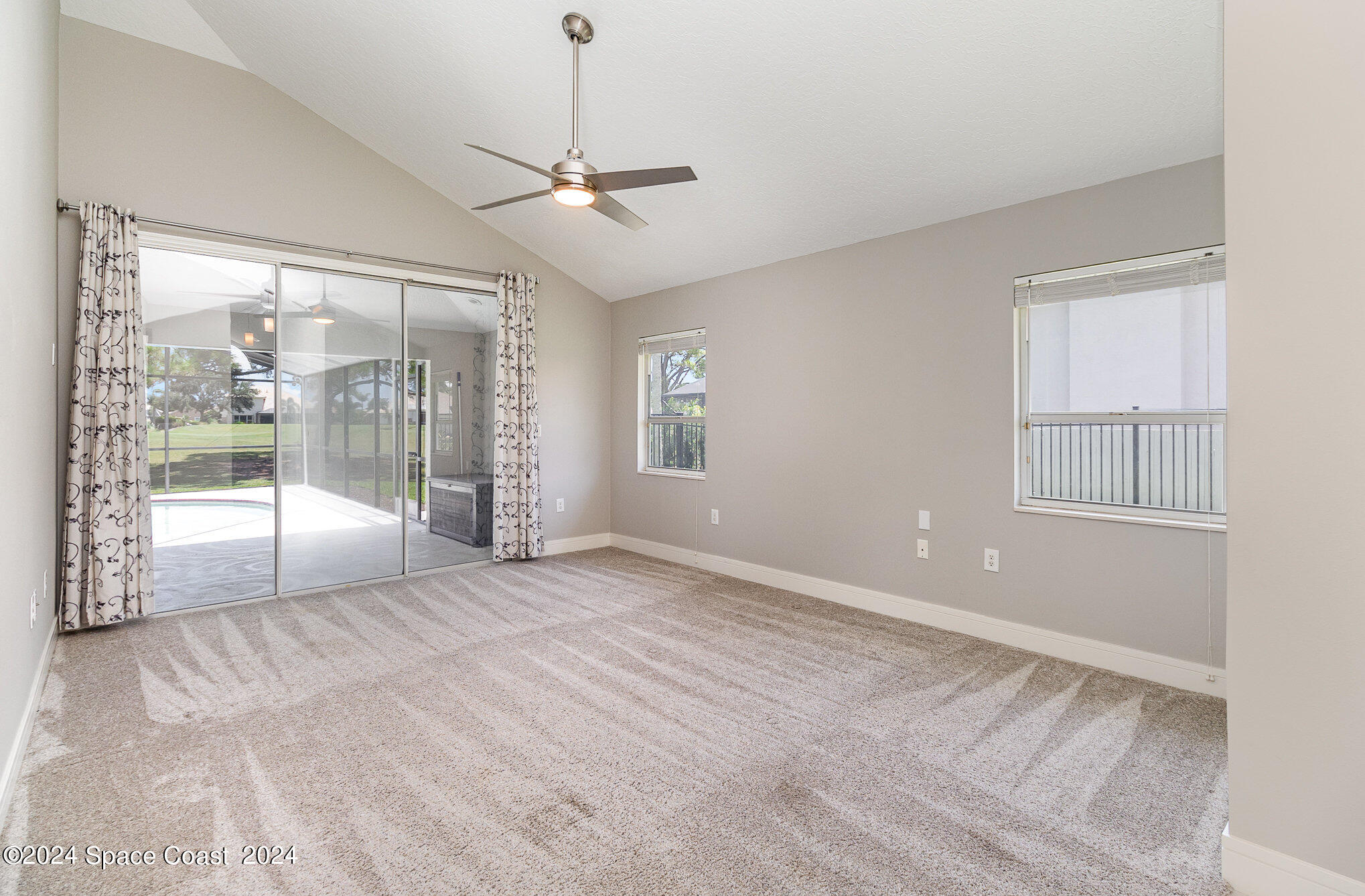 697 Spring Lake Drive Melbourne, FL 32940 - Photo 18 of 51 a view of an empty room with a window