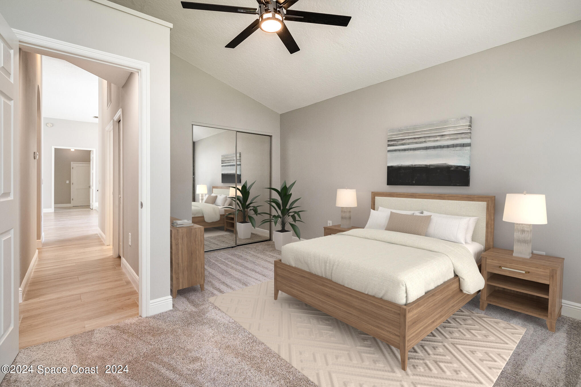 697 Spring Lake Drive Melbourne, FL 32940 - Photo 22 of 51 a bedroom with a large bed and ceiling fan