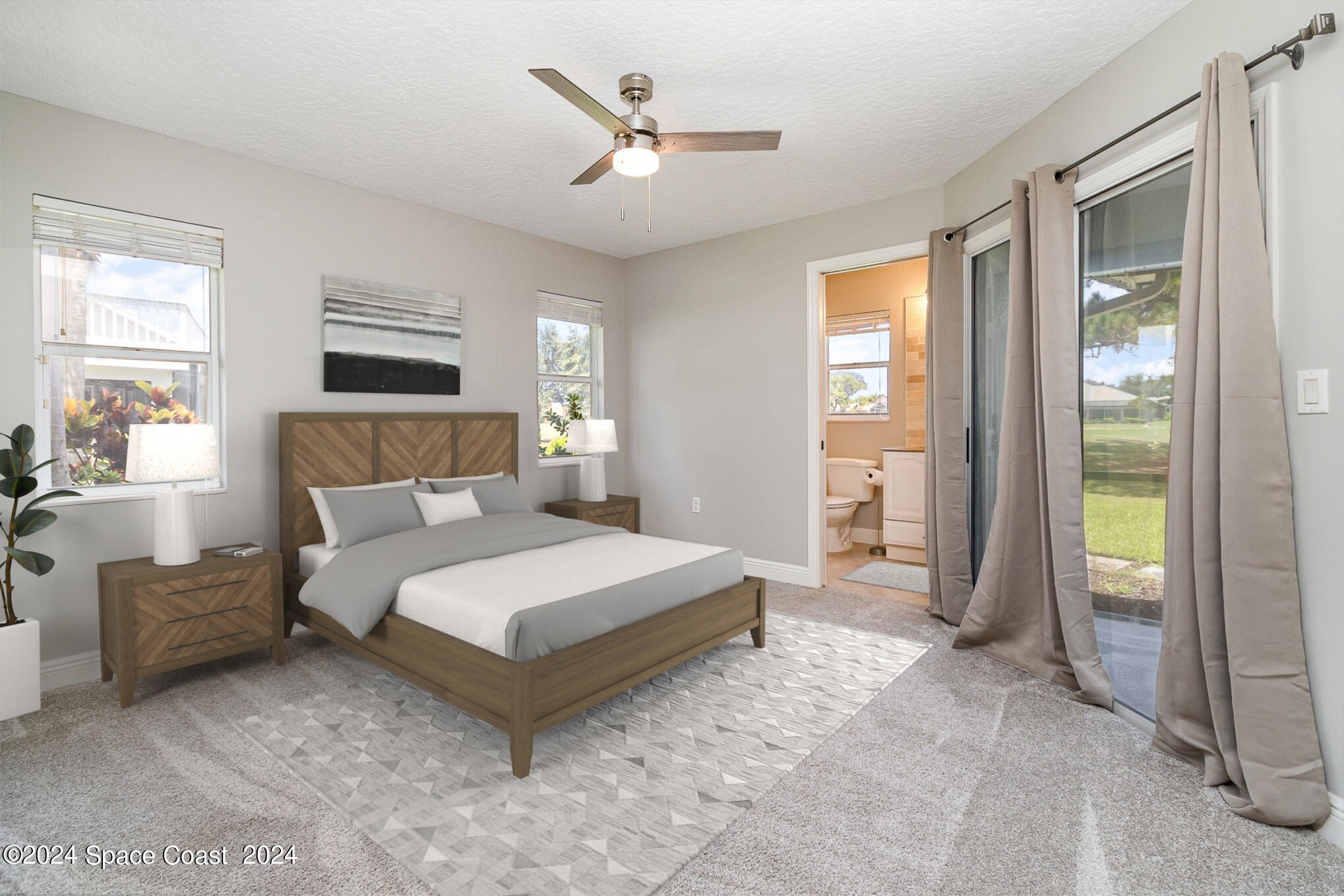 697 Spring Lake Drive Melbourne, FL 32940 - Photo 26 of 51 a bedroom with a large bed and a chandelier