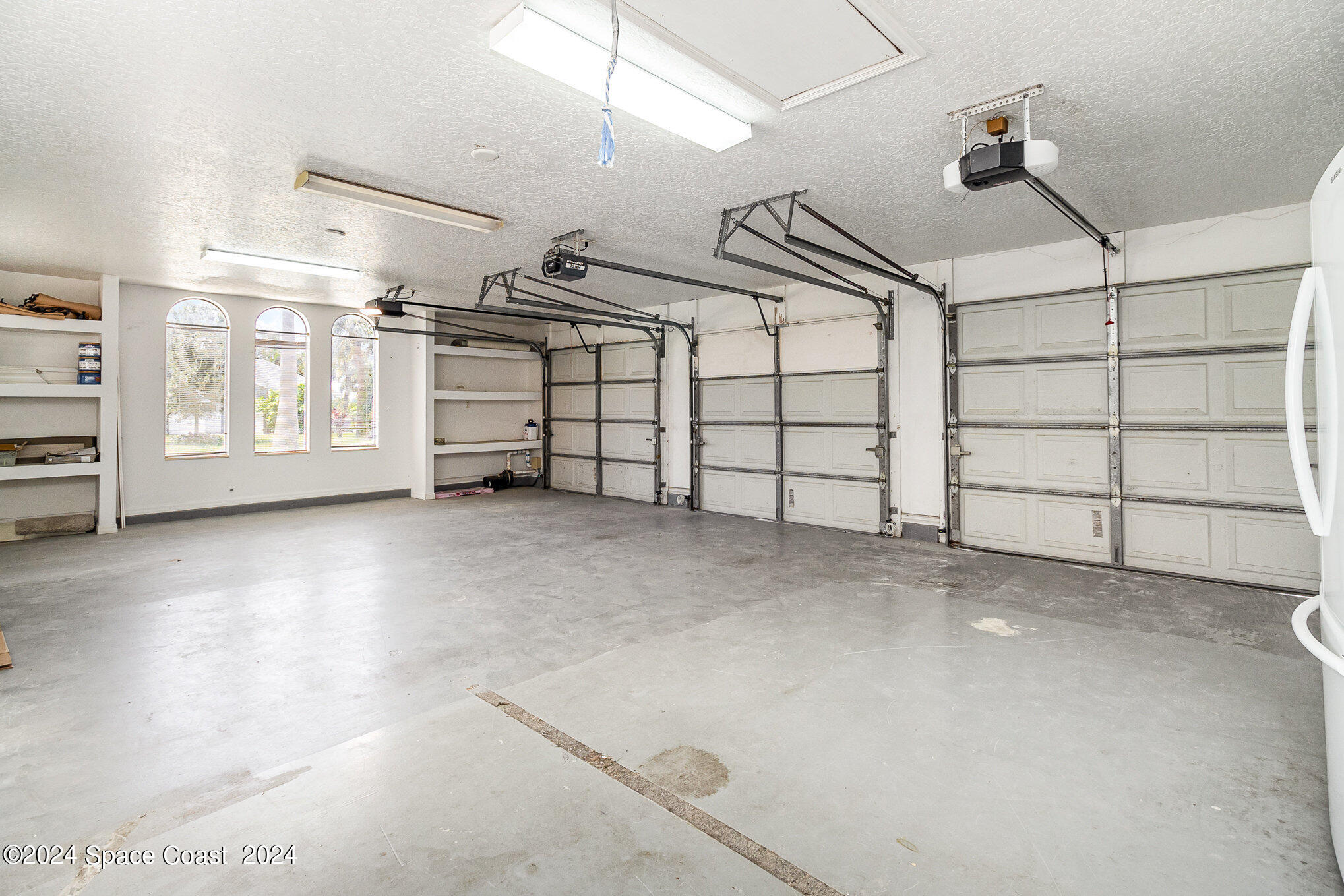 697 Spring Lake Drive Melbourne, FL 32940 - Photo 31 of 51 a view of a garage