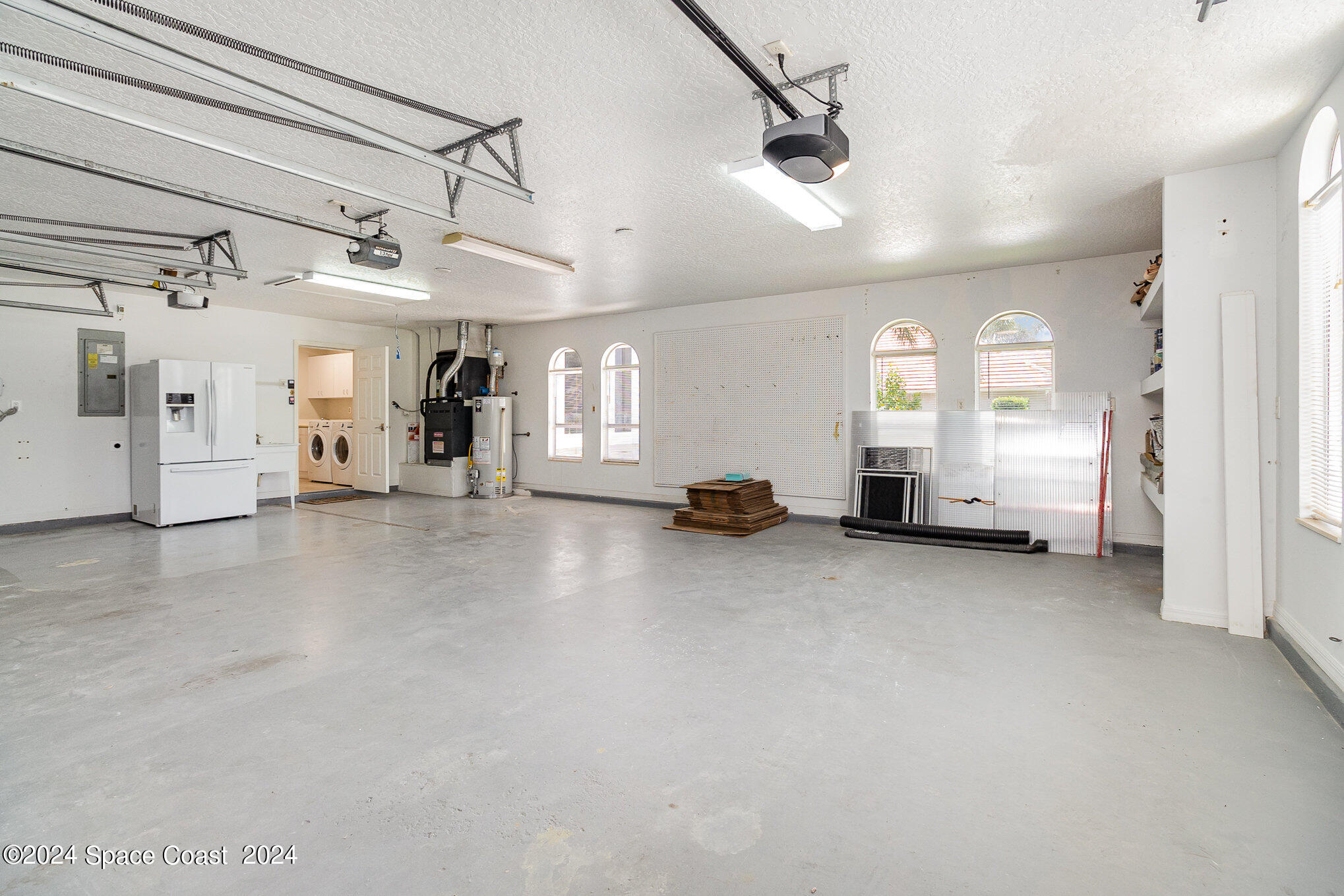 697 Spring Lake Drive Melbourne, FL 32940 - Photo 32 of 51 a view of a livingroom with furniture and a living room
