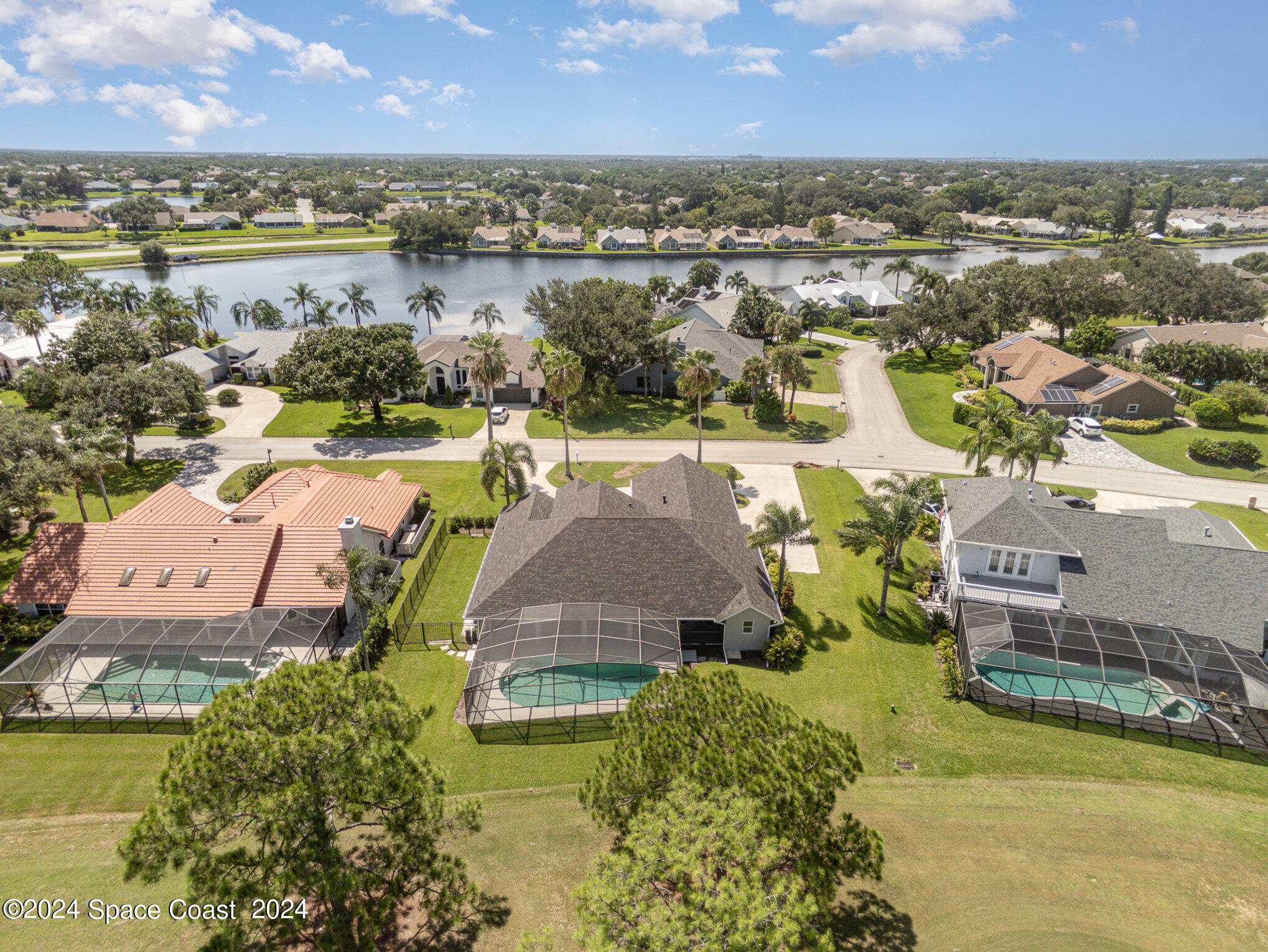 697 Spring Lake Drive Melbourne, FL 32940 - Photo 40 of 51 an aerial view of a house with a lake view
