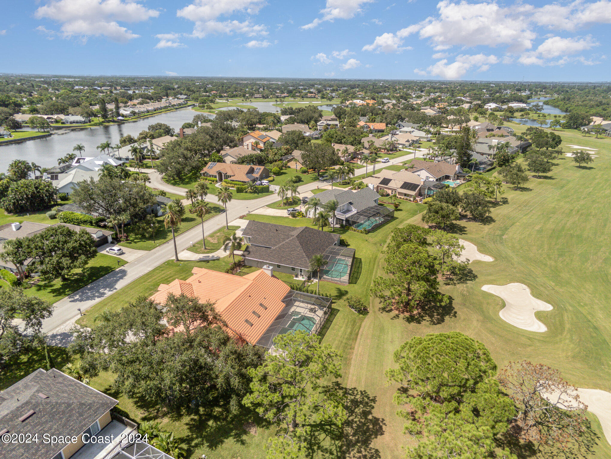 697 Spring Lake Drive Melbourne, FL 32940 - Photo 41 of 51 an aerial view of residential houses with outdoor space