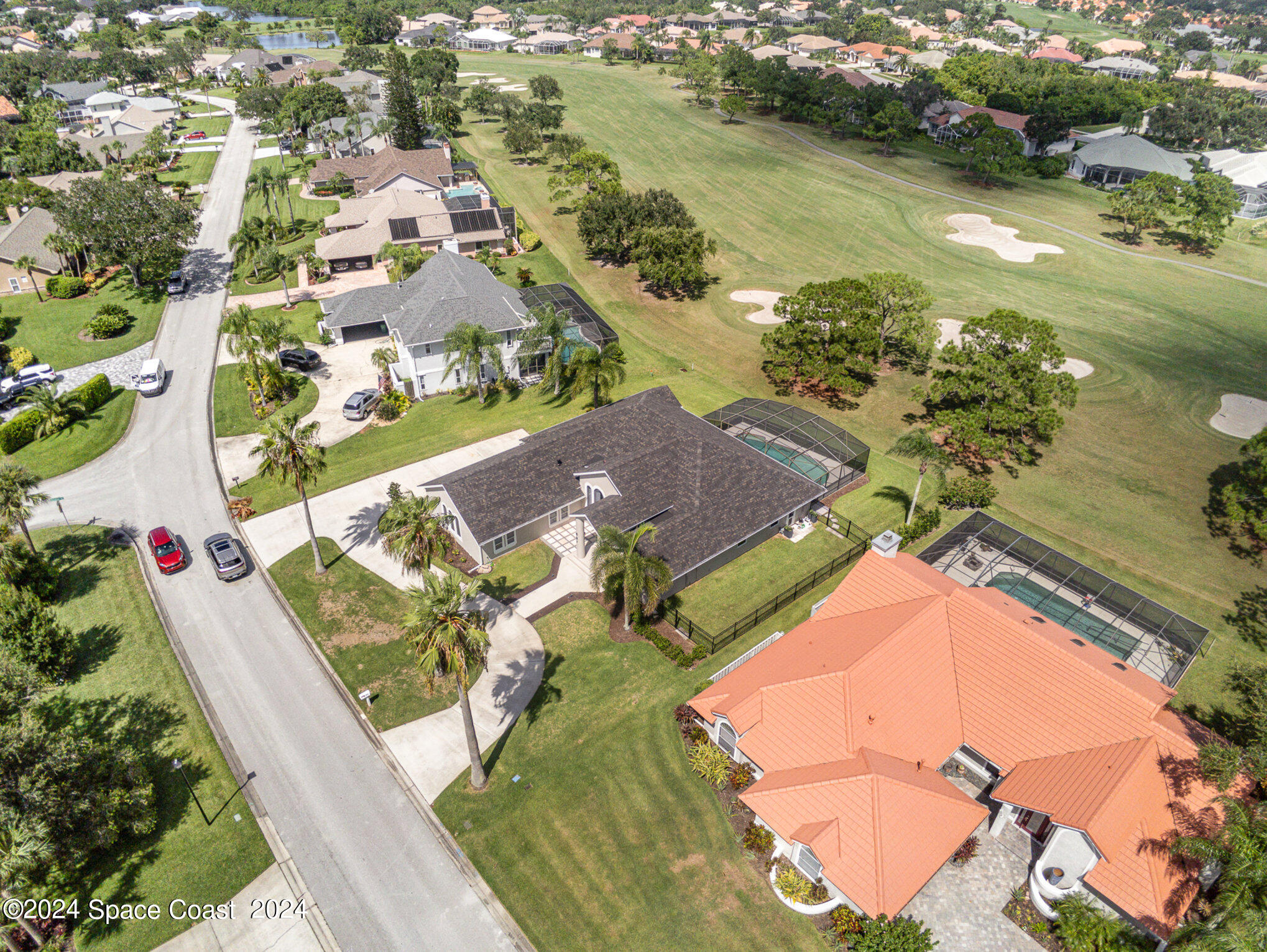 697 Spring Lake Drive Melbourne, FL 32940 - Photo 42 of 51 an aerial view of residential houses with outdoor space