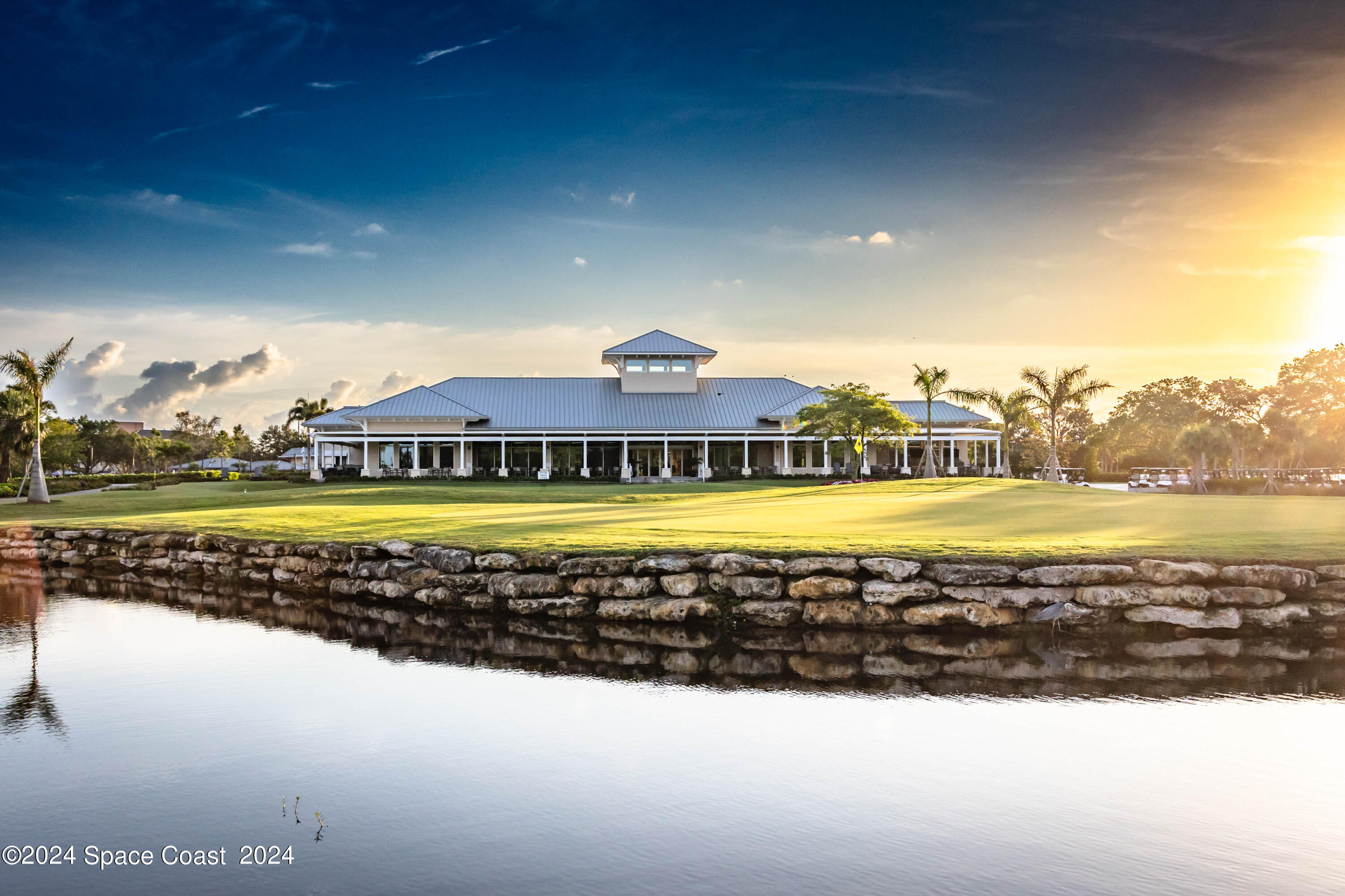 697 Spring Lake Drive Melbourne, FL 32940 - Photo 50 of 51 a view of a swimming pool with a yard