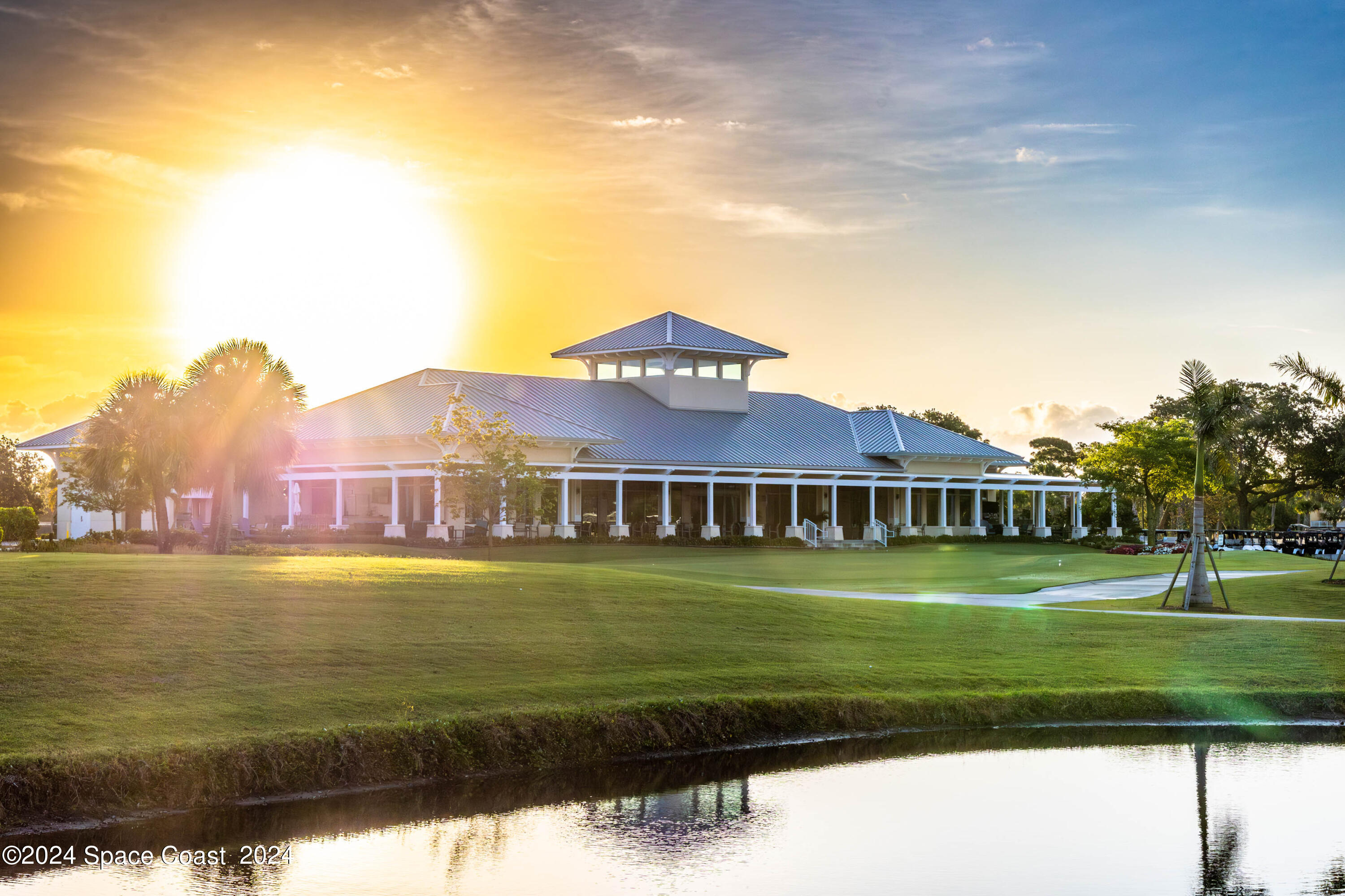 697 Spring Lake Drive Melbourne, FL 32940 - Photo 51 of 51 a front view of a house with a garden
