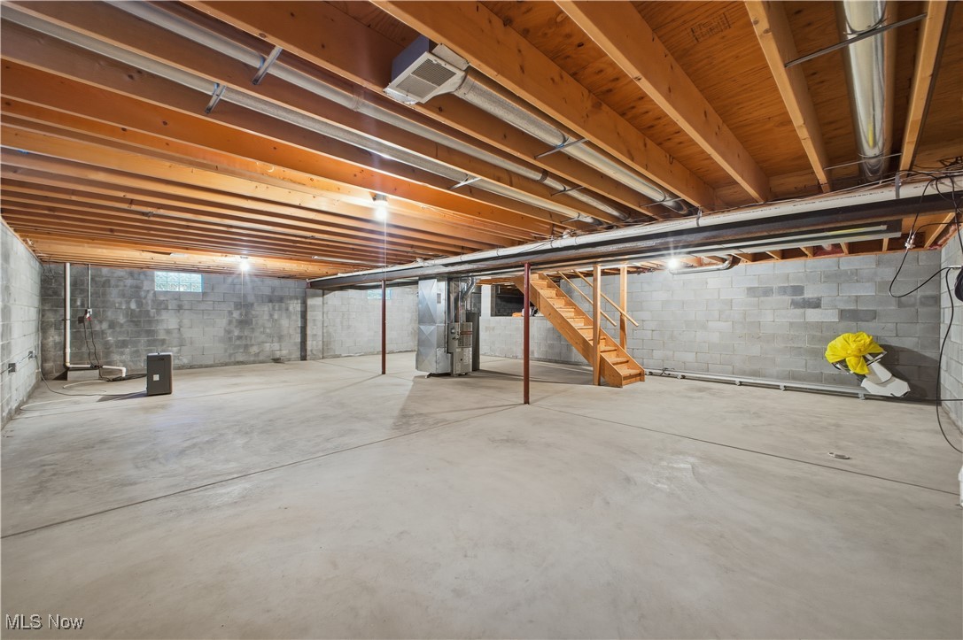 197 Mathews Road, Unit B Youngstown, OH 44512 - Photo 24 of 37 Unfinished below grade area with stairs and heating unit